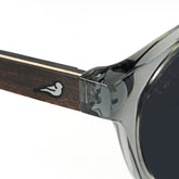 Close up detail of clear grey frame sunglasses with polarised lenses