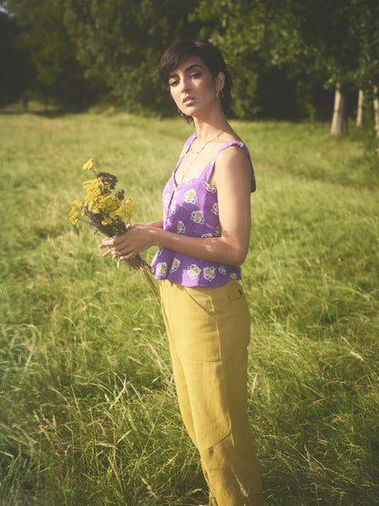 Side view of model wearing Lowie Les Indiennes Lavender Peplum Cami Top showing sweetheart neckline